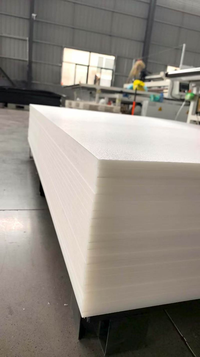 Stack of white HDPE mats